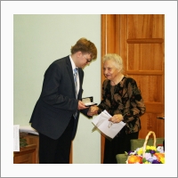 Congratulation of  the Insitute’s veterans  Scientific Secretary R.A. Bredikhin and L.K. Kozachok